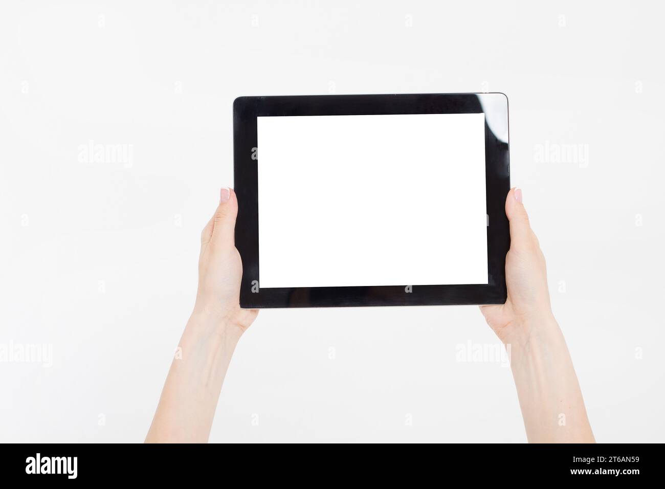 Hand holding black tablet isolated on white clipping path inside. Top ...
