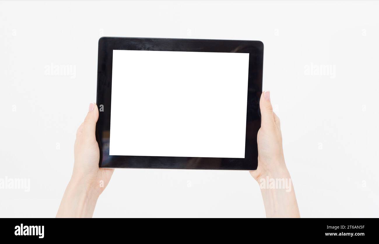 Hand holding black tablet isolated on white clipping path inside. Top ...