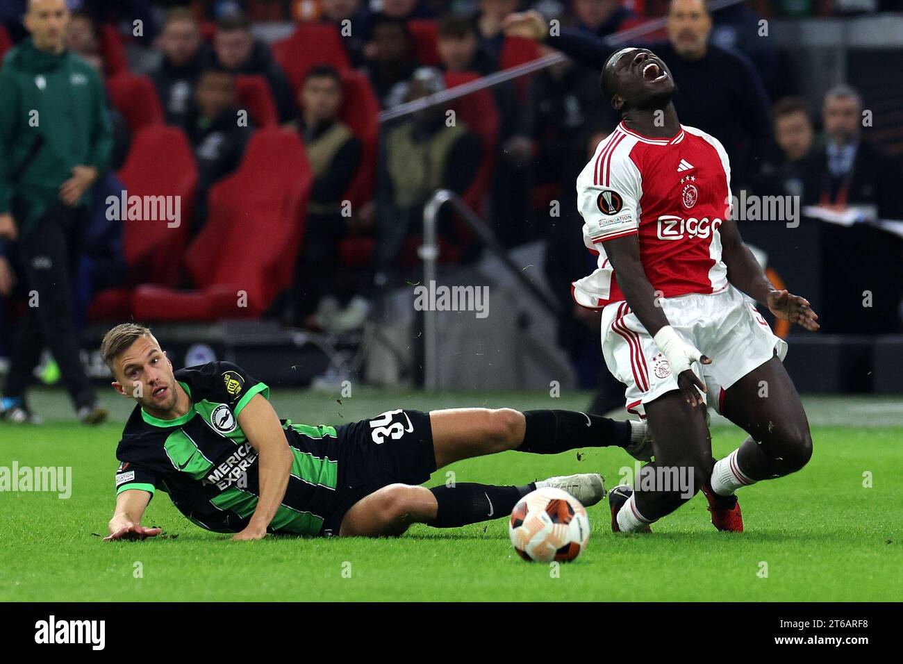 Amsterdam, Netherlands. 9th Nov, 2023. Brian Brobbey (9 Ajax) is tackled by Joel Veltman (34 Brighton) during the UEFA Europa League football match between Ajax and Brighton at The Johan Cruyff ArenA in Amsterdam, Netherlands. (James Whitehead/SPP) Credit: SPP Sport Press Photo. /Alamy Live News Stock Photo