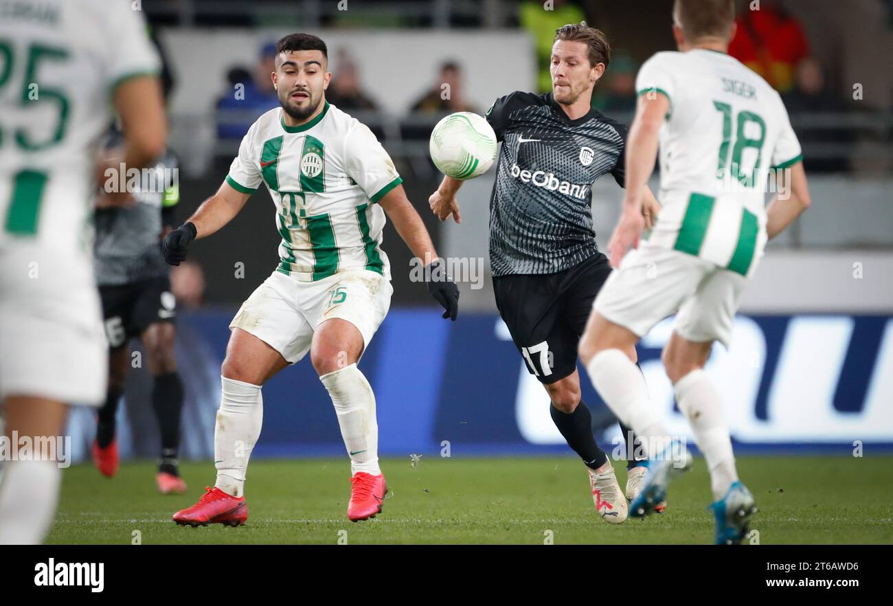 BUDAPEST, HUNGARY - AUGUST 13: (l-r) Tokmac Chol Nguen of Ferencvarosi TC  wins the ball from Arijan Ademi of GNK Dinamo Zagreb during the UEFA  Champions League Third Qualifying Round match between