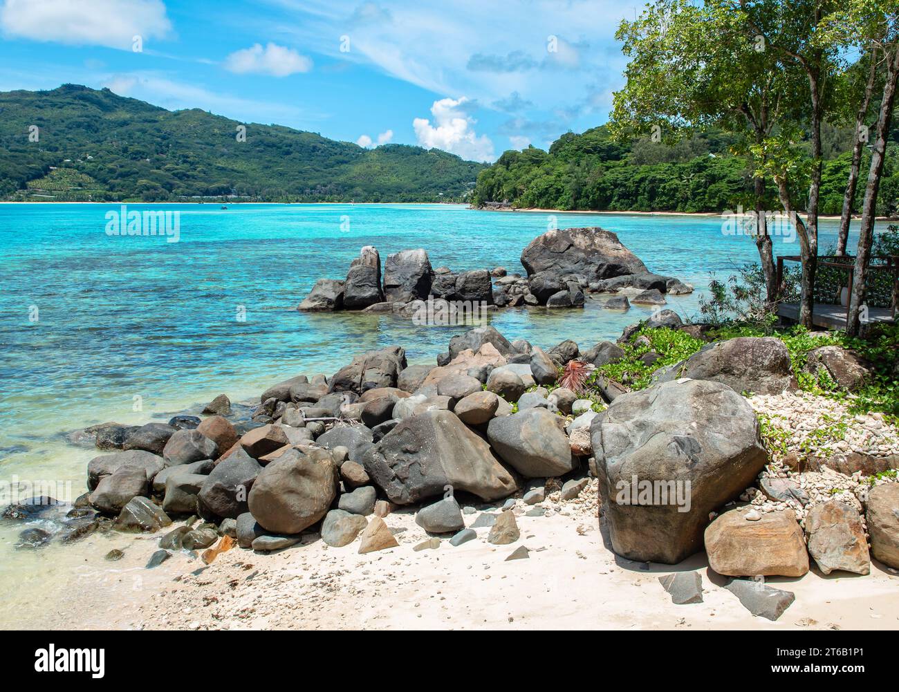 Small beach with rocks on Mahe Island, Seychelles. Stock Photo