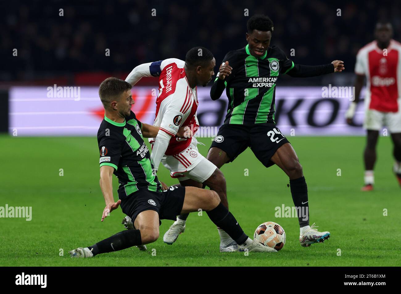 Amsterdam, Netherlands. 9th Nov, 2023. Joel Veltman (34 Brighton) and Steven Bergwihjn (7 Ajax) battle for possession during the UEFA Europa League football match between Ajax and Brighton at The Johan Cruyff ArenA in Amsterdam, Netherlands. (James Whitehead/SPP) Credit: SPP Sport Press Photo. /Alamy Live News Stock Photo