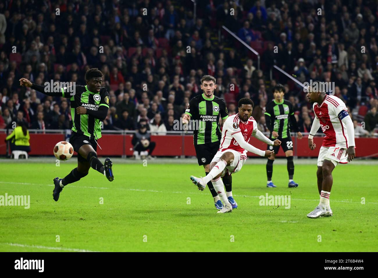 AMSTERDAM (lr) Carlos Baleba of Brighton Hove Albion, Chuba Akpom of Ajax during the UEFA AMSTERDAM (lr) Carlos Baleba of Brighton Hove Albion, Chuba Akpom of Ajax during the UEFA