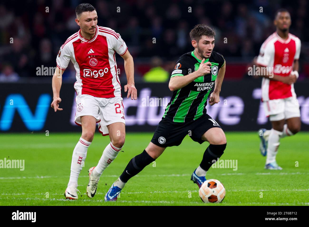 AMSTERDAM, NETHERLANDS - NOVEMBER 9: Steven Berghuis (Ajax) and Billy Gilmour (Brighton & Hove Albion) battle for the ball during the Group B - UEFA E Stock Photo