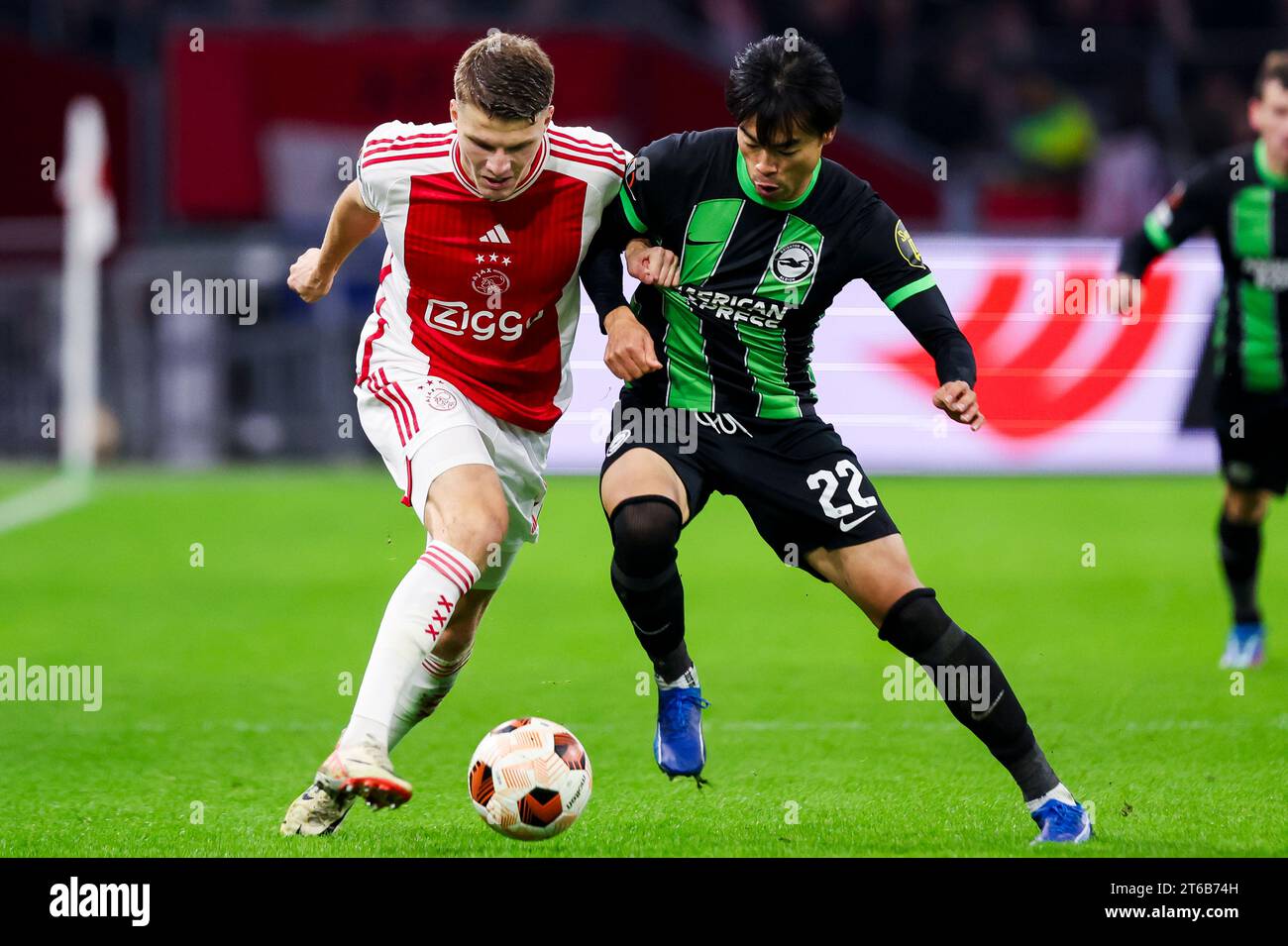 AMSTERDAM, NETHERLANDS NOVEMBER 9 Anton Gaaei (Ajax) and Kaoru Mitoma (Brighton & Hove Albion AMSTERDAM, NETHERLANDS NOVEMBER 9 Anton Gaaei (Ajax) and Kaoru Mitoma (Brighton & Hove Albion
