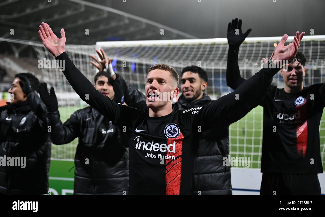 Helsinki, Finland. 09th Nov, 2023. Soccer: UEFA Europa Conference League, HJK Helsinki - Eintracht Frankfurt, group stage, Group G, matchday 4, at the Bolt Arena. Frankfurt players Makoto Hasebe (l-r), Farès Chaibi, Elias Baum, Omar Marmoush and Nacho Ferri celebrate the 1:0 victory in front of the visitors' block. Credit: Arne Dedert/dpa/Alamy Live News Stock Photo