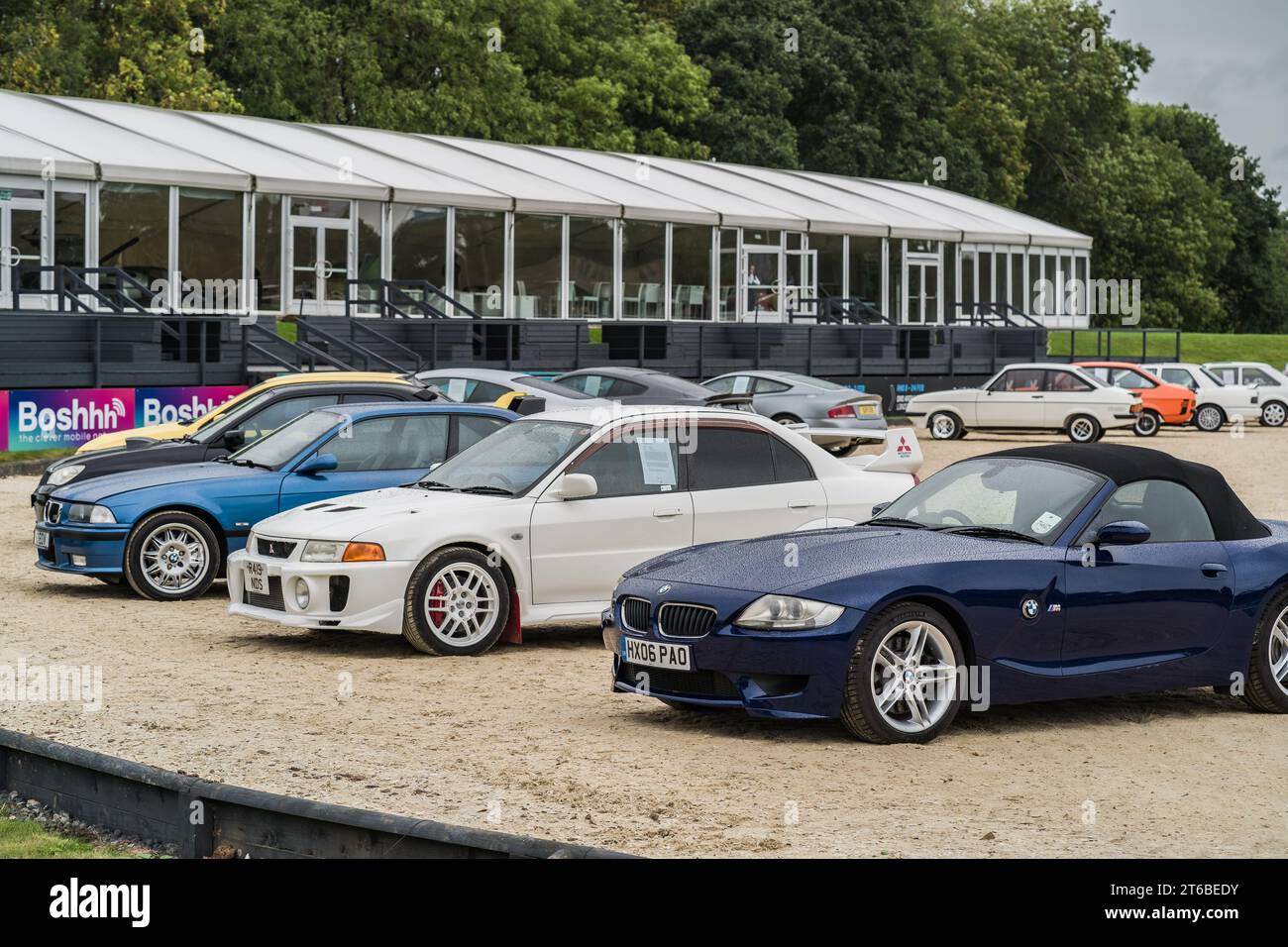 Chester, Cheshire, England, September 30th 2023. Blue BMW Z4 and a white Mitsubishi EVO V at a classic car display. Stock Photo