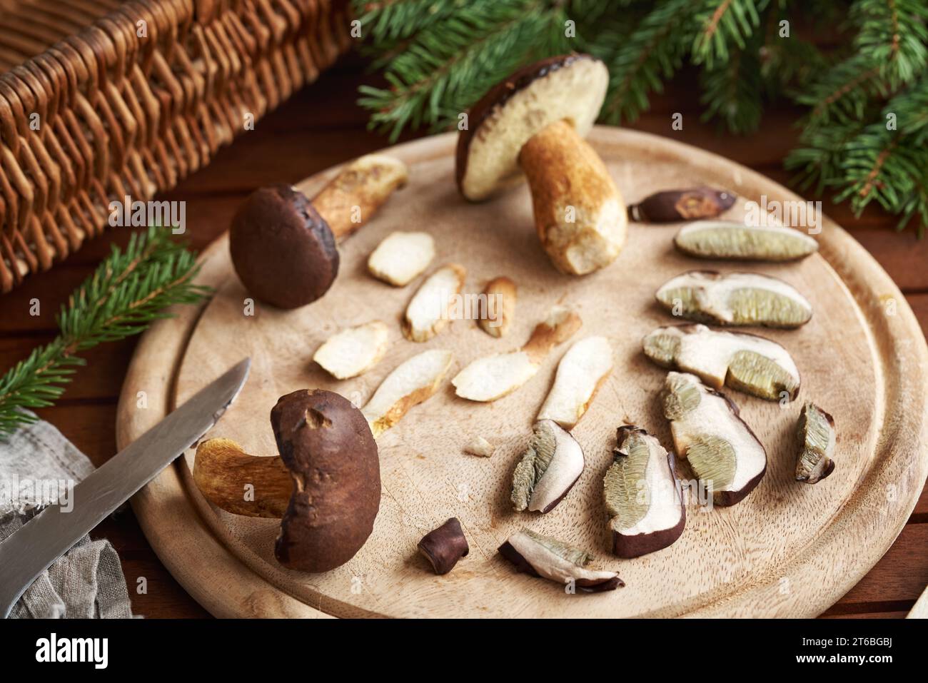 Fresh whole and sliced pine boletes on a table - wild edible mushrooms Stock Photo