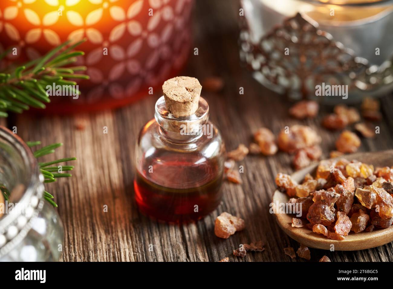 Myrrh essential oil and resin with a candle Stock Photo