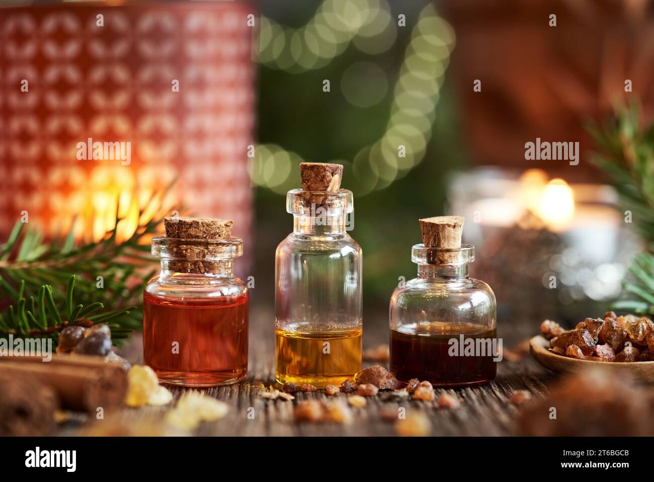 Christmas selection of essential oils with frankincense, myrrh, cinnamon and spruce tree branches Stock Photo