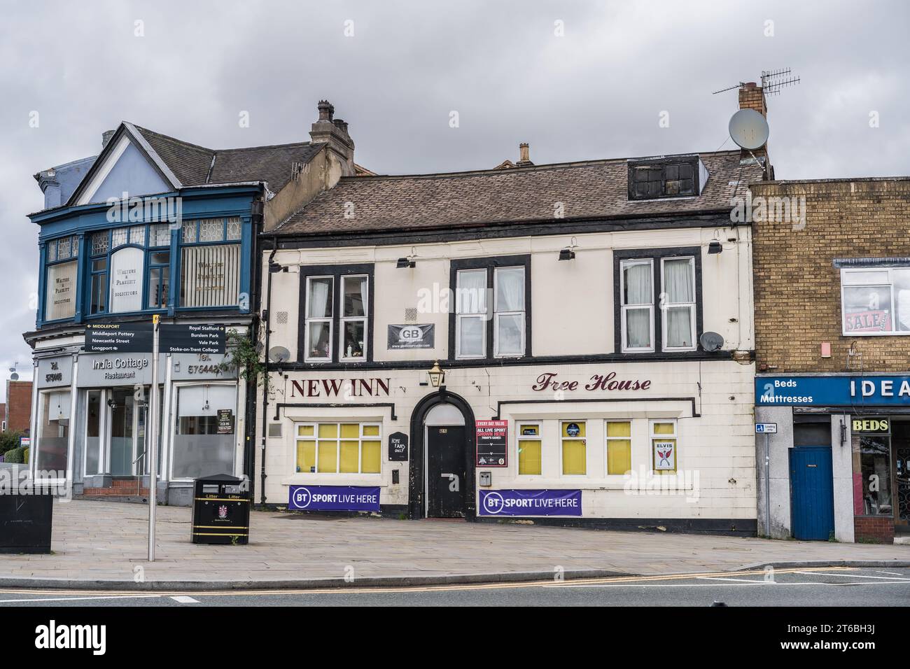 Burslem, Stoke on Trent, England, March 21st 2023. New Inn free house with India Cottage Restaurant on downtown street, editorial illustration. Stock Photo