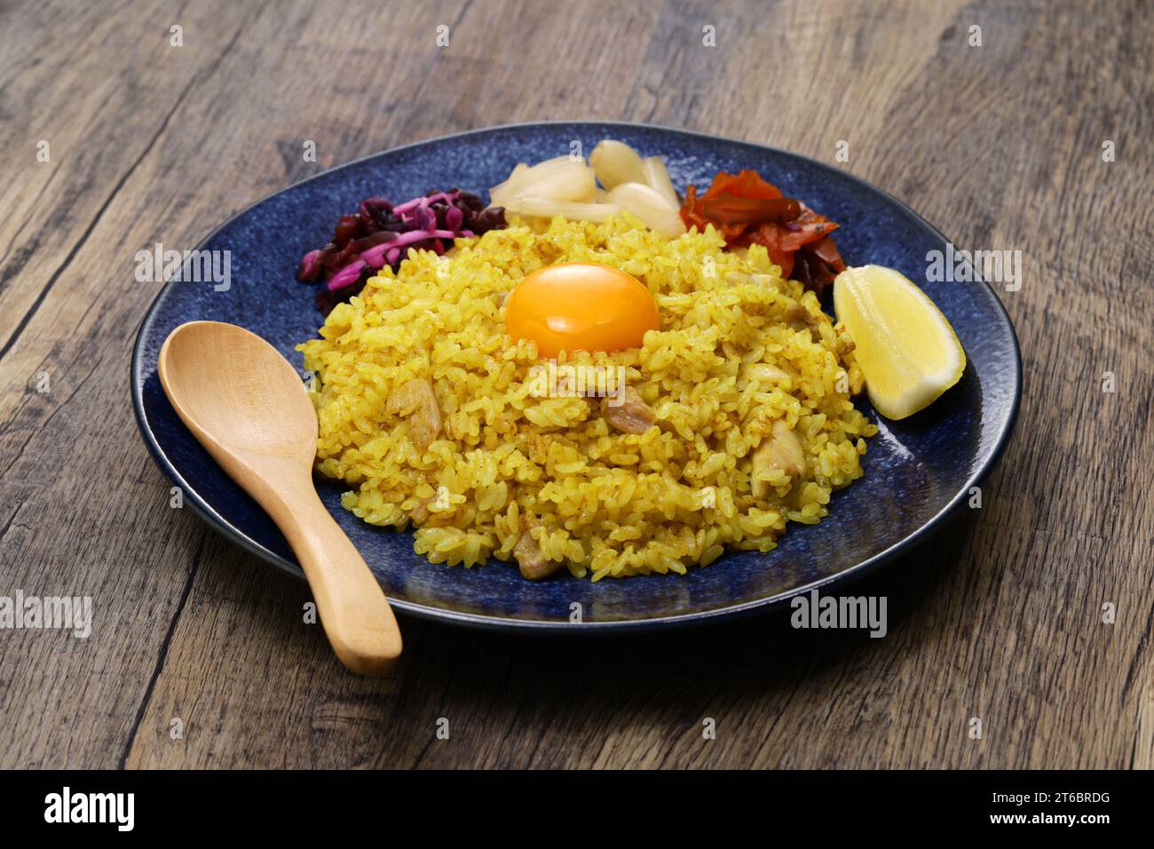 Japanese dry curry is curry rice that uses curry powder without gravy. It is rice cooked in soup with chicken and vegetables, then curry spices added Stock Photo