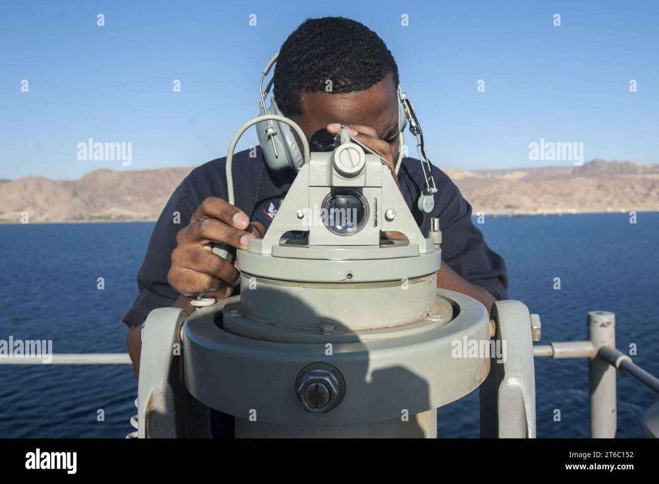 USS America Sailors measure ship’s bearing (37510970321) Stock Photo