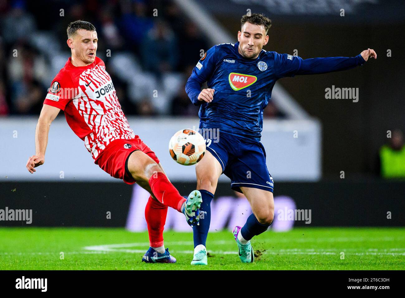 Fortune Bassey of Ferencvarosi TC battles for the ball in the air News  Photo - Getty Images