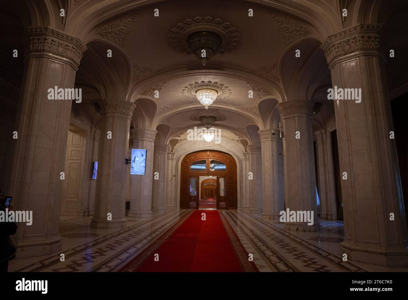 Picture of the interior of the Romanian palace of parliament, with a focus on large wooden doors. The Palace of the Parliament, also known as the Repu Stock Photo
