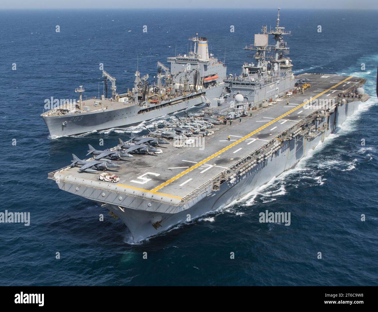 USS Bataan and USNS Laramie conduct a replenishment-at-sea Stock Photo ...