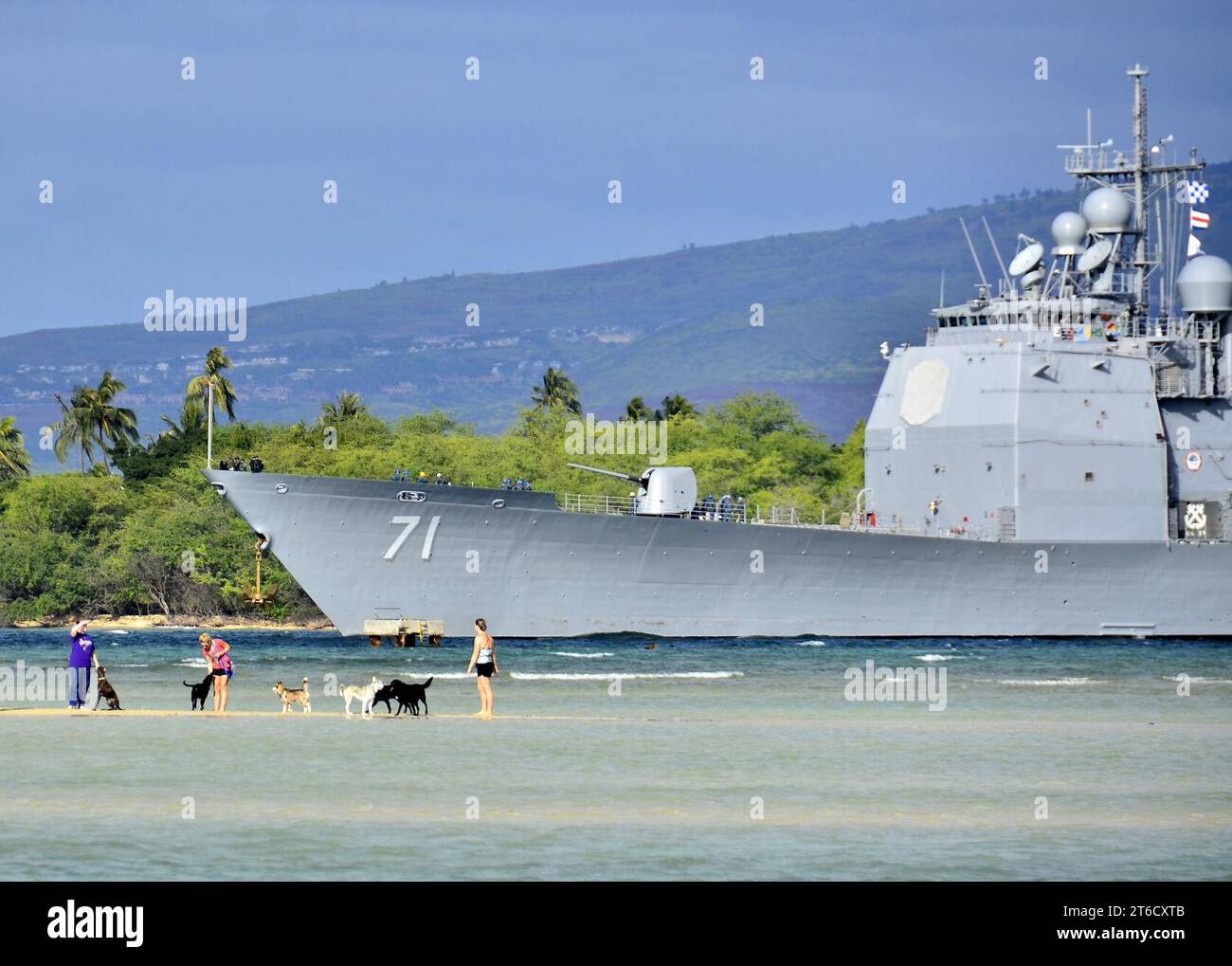 USS Cape St. George transits Pearl Harbor. Stock Photo