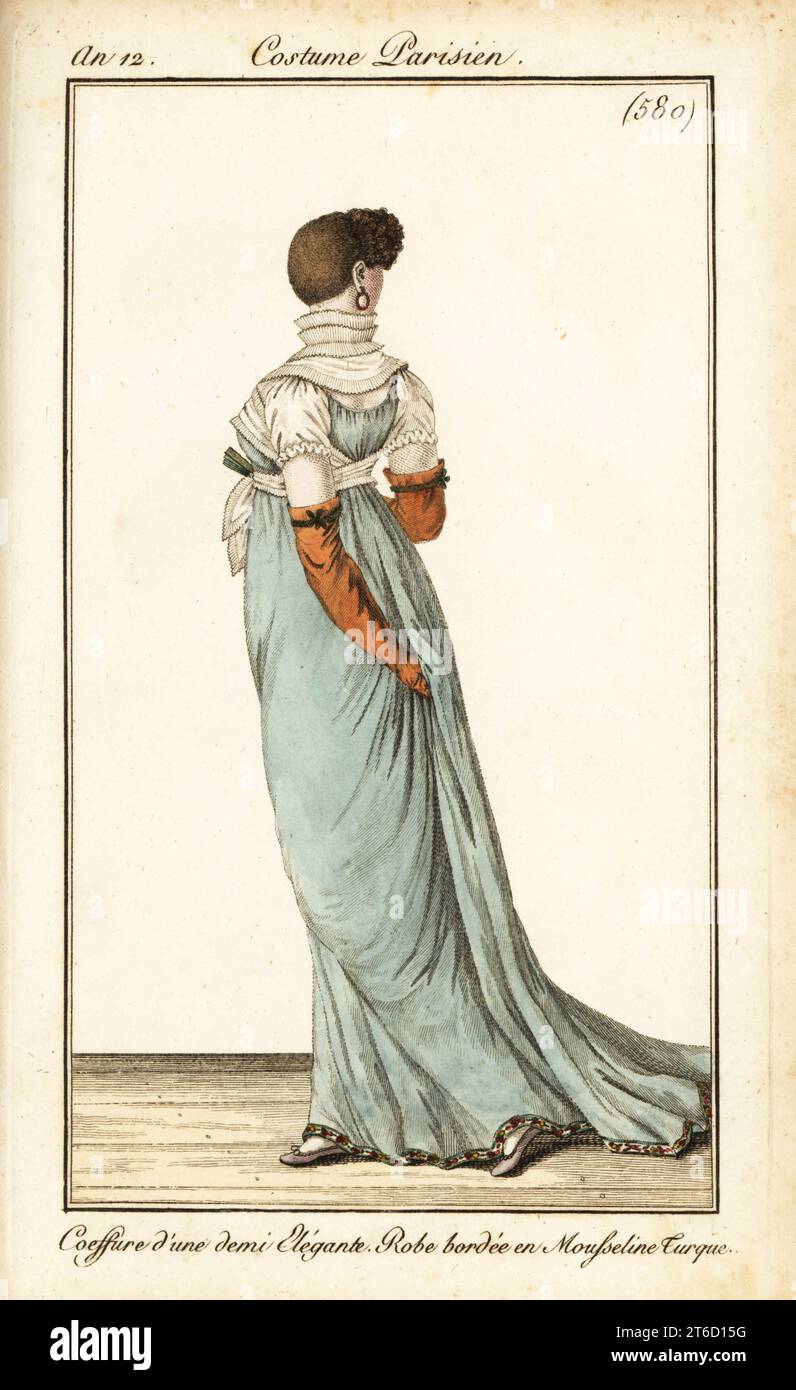 Rear view of woman with very short hair, curls at the front, funnel collar, and dress bordered with Turkish muslin. Coeffure d'une demi Elegante, robe bordee en mousseline Turque, Colerette en Entonnoir. Handcoloured copperplate engraving from Pierre de la Mesangeres Journal des Dames et des Modes, Magazine of Women and Fashion, Paris, An 12, September 1804. Illustrations by Carle Vernet, Jean-Francois Bosio, Dominique Bosio and Philibert Louis Debucourt, engraved by Pierre-Charles Baquoy. Stock Photo