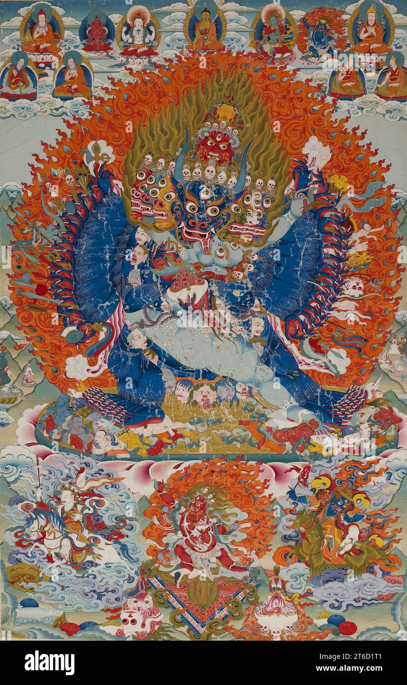 Vajrabhairava with Vajravetali, 18th century. The enlightened wrathful deity Vajrabhairava, Buddhist conqueror of death, embraces his female partner, Vajravetali. His nine heads include that of a buffalo, the animal associated with the defeated god of death, and the crowning yellow face of Manjushri, bodhisattva of wisdom, with whom Vajrabhairava is associated. Vajrabhairava&#x2019;s central crown of skulls is topped with images of five peaceful Buddhas, a reminder that his gruesome imagery, by forcing us to confront what we fear, ultimately supports the goal of enlightenment. Stock Photo