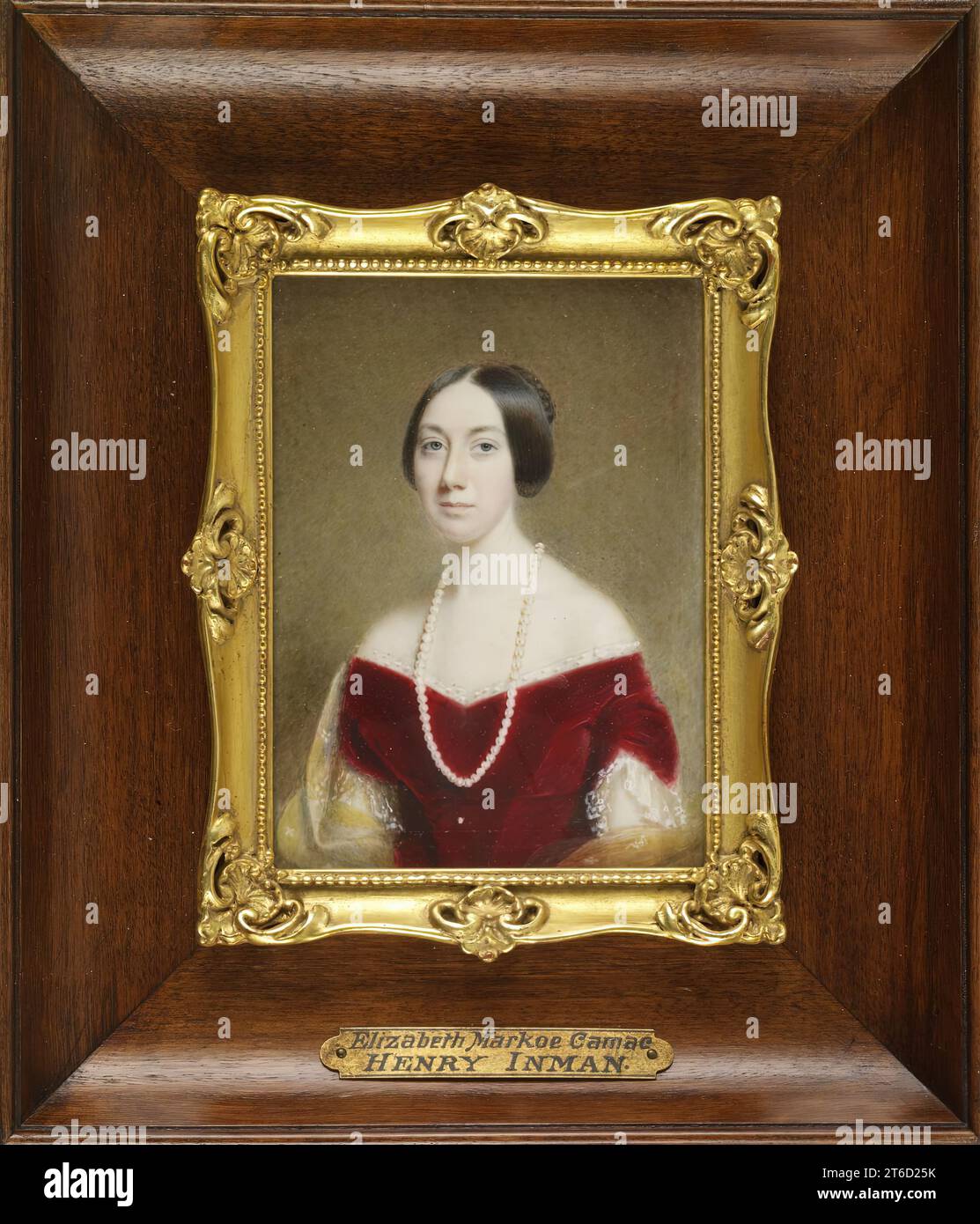 Elizabeth Baynton Markoe Camac, c1840. Waist-length portrait of Elizabeth Baynton Markoe (1807-1886), who married William Masters Camac in 1829. She is shown with straight black hair, parted in the centre, wearing a low-cut red velvet dress with short sleeves trimmed with lace. She has one long strand of pearls around her neck, and a yellow shawl draped over her lower arms. Stock Photo