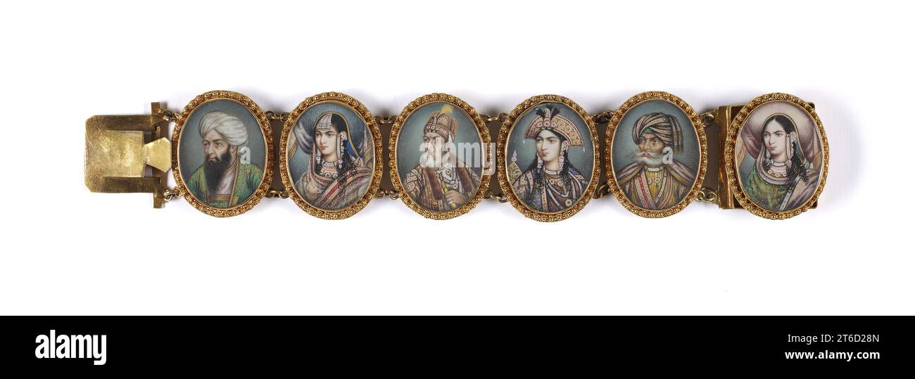 Bracelet with Portrait Miniatures, 1860-1870. The six portraits are of revered Mughal rulers and their royal wives. The third oval from the left, for example, is a portrait of the last Mughal emperor, Bahadur Shah Zafar (r. 1837-57, d. 1862). A skilled calligrapher, Bahadur was well versed in the history of art, architecture, garden design, and poetry. The fourth oval is a portrait of Arjumand Banu Begam, better known as known as Mumtaz Mahal (Elect of the Palace), the beloved wife of Shah Jahan (r. 1628-58). She died after giving birth to her 14th child in 1631. Shah Jahan built a great mauso Stock Photo