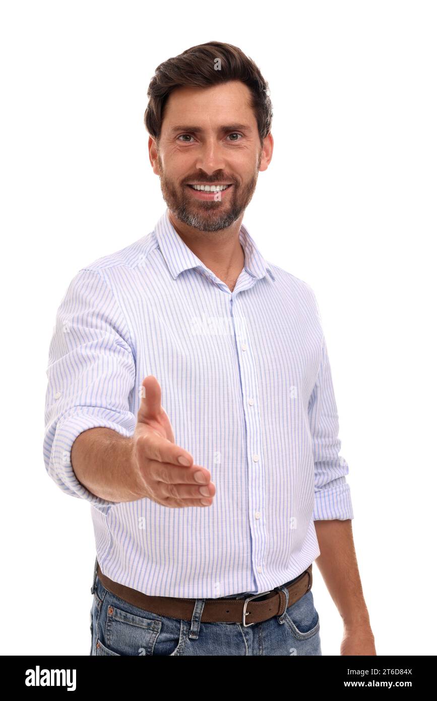 Happy man welcoming and offering handshake on white background Stock ...