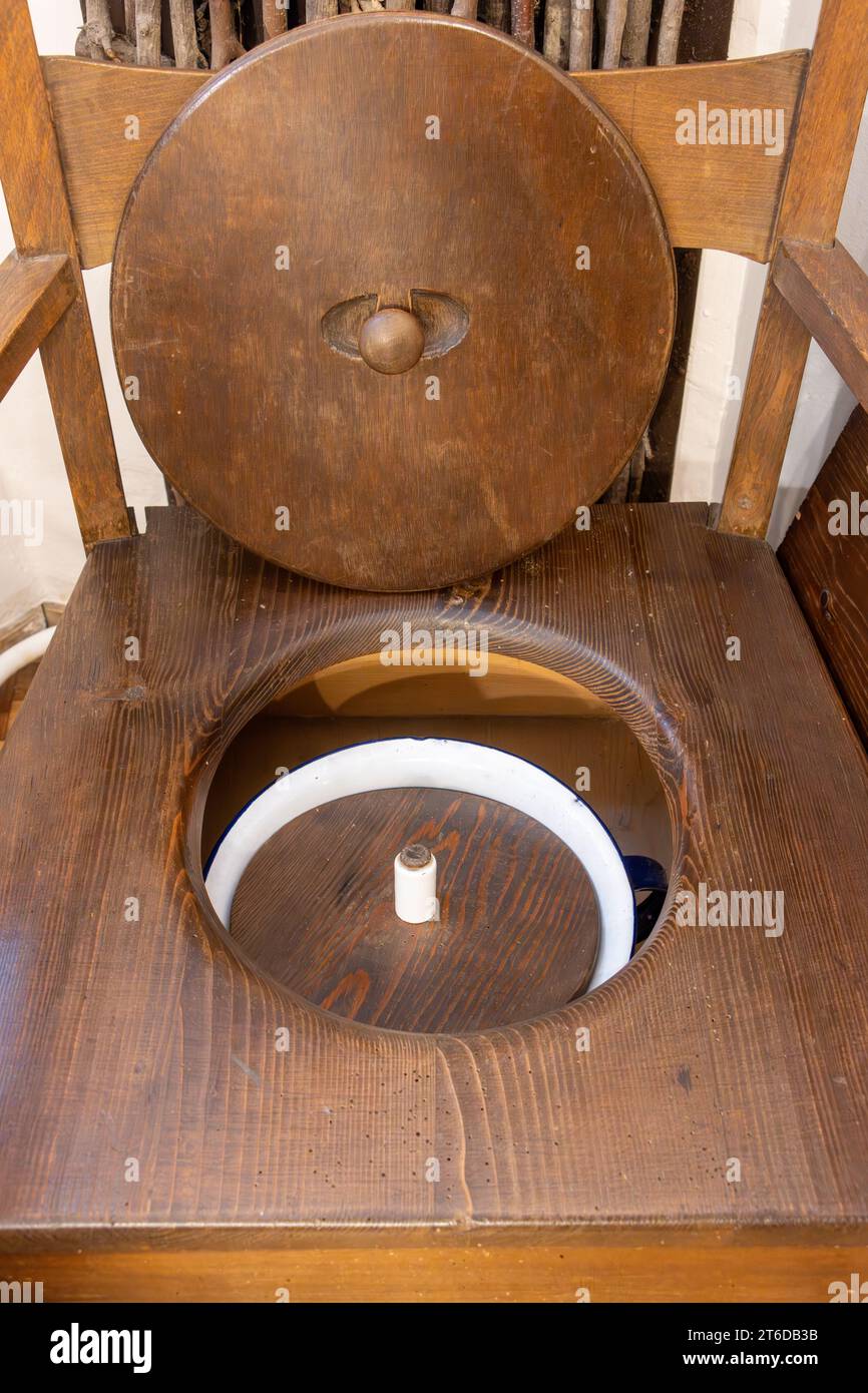 Antique wooden commode chamber pot toilet chair seat Stock Photo