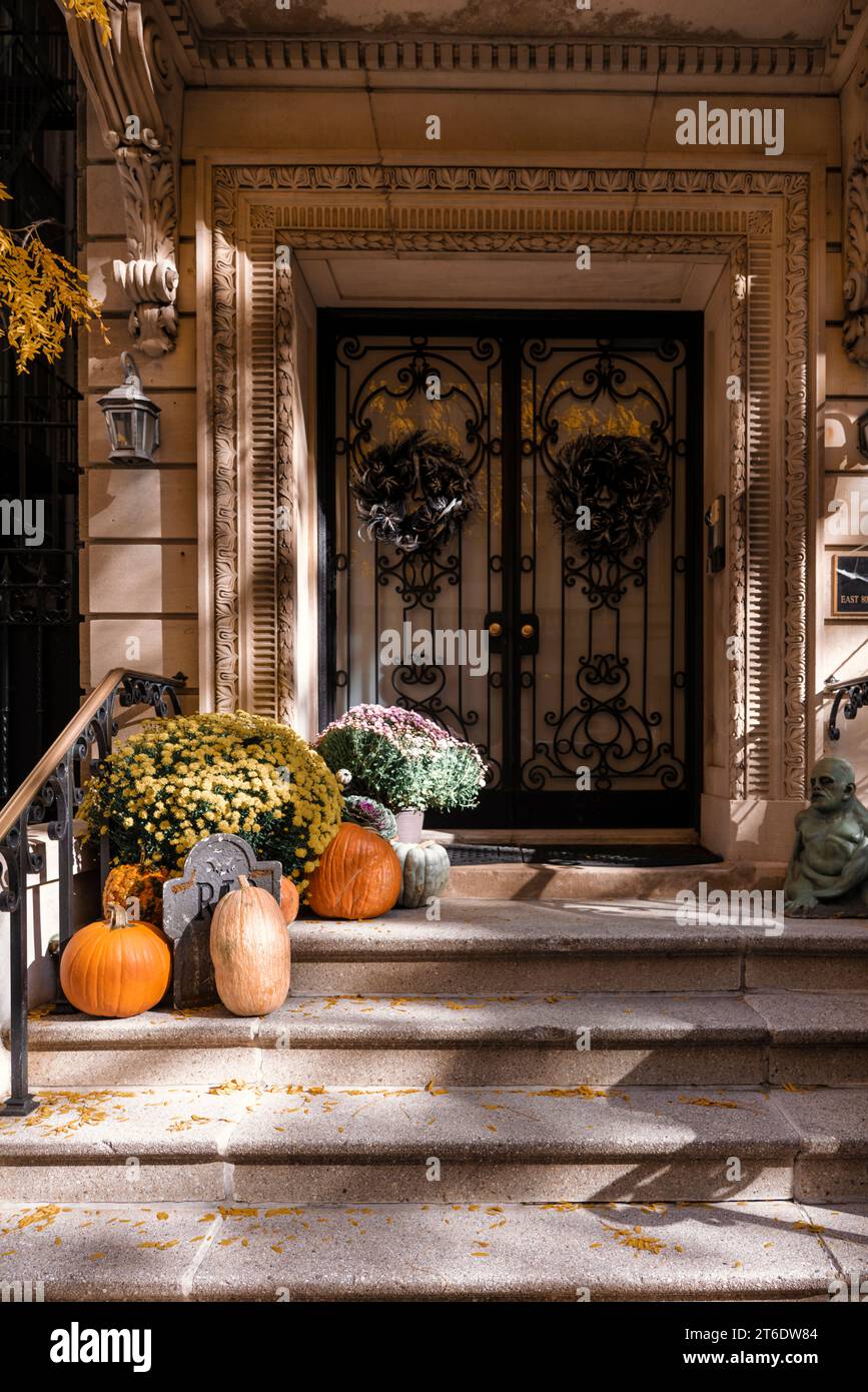 Colorful Pumpkins and Flowers on the Stairs of an Old Brownstone Home ...