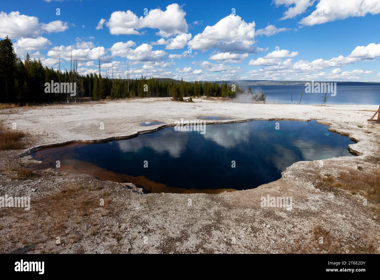 The Abyss Pool in the West Thumb Geyser Basin lies along the shore of Yellowstone National Park in Wyoming. Stock Photo