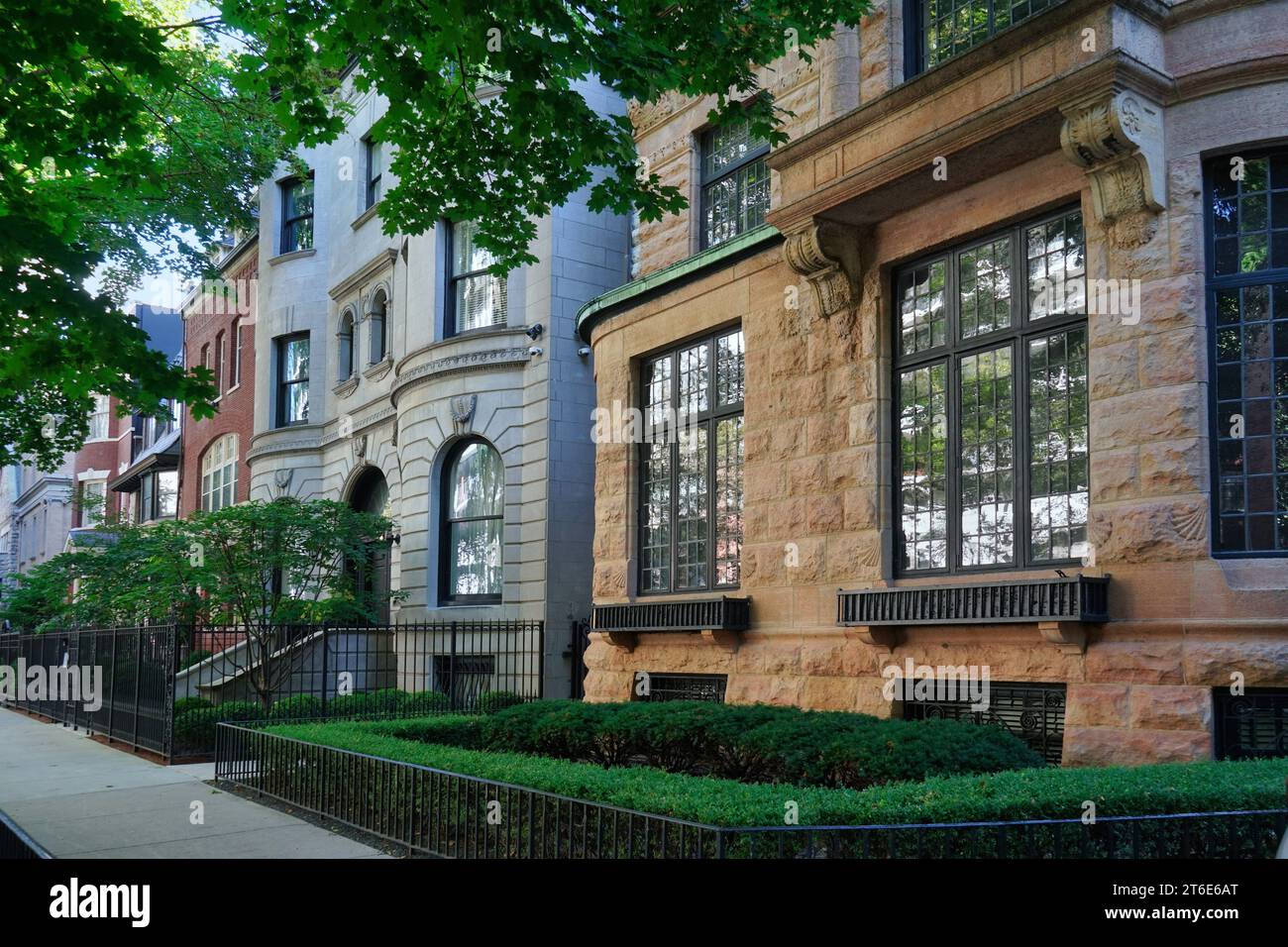 Row of ornate old 19th century townhouses with small front garden Stock ...