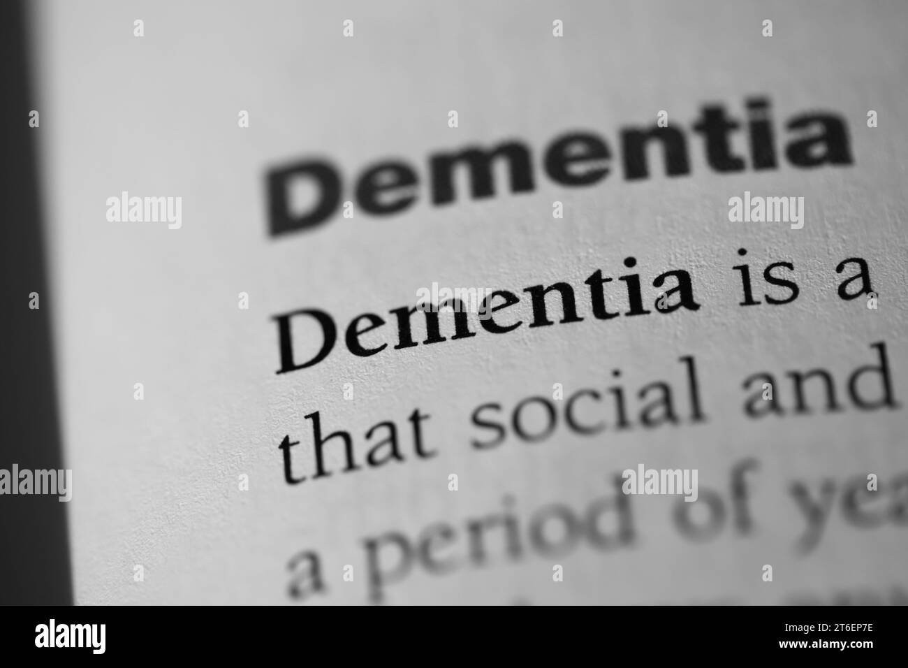 A close-up of the psychological or mental disorder term 'Dementia' written in black on a white paper Stock Photo