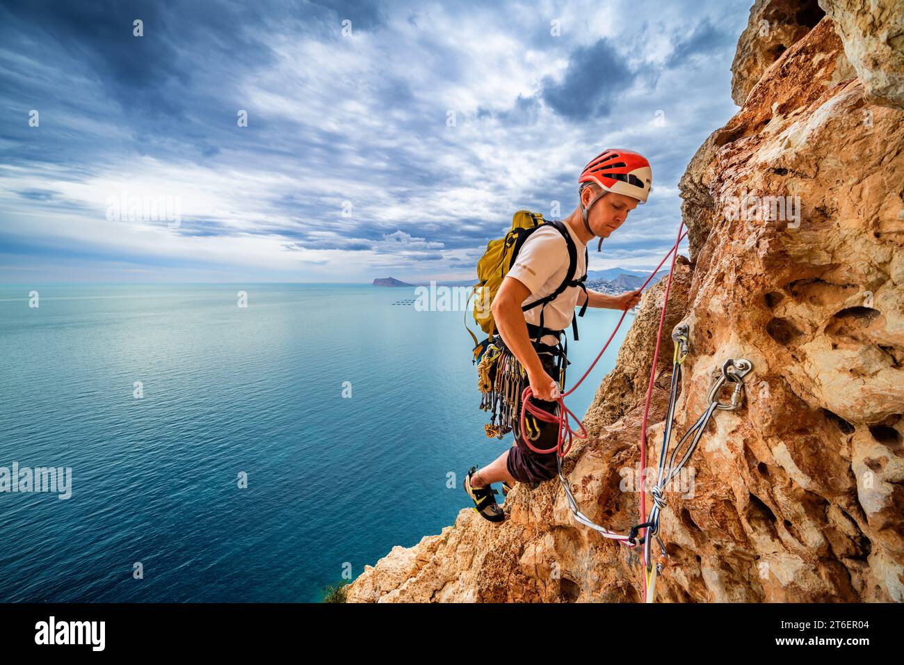 Trad rock climbing in Penyal d'Ifac National Park near Calp, Spain Stock Photo