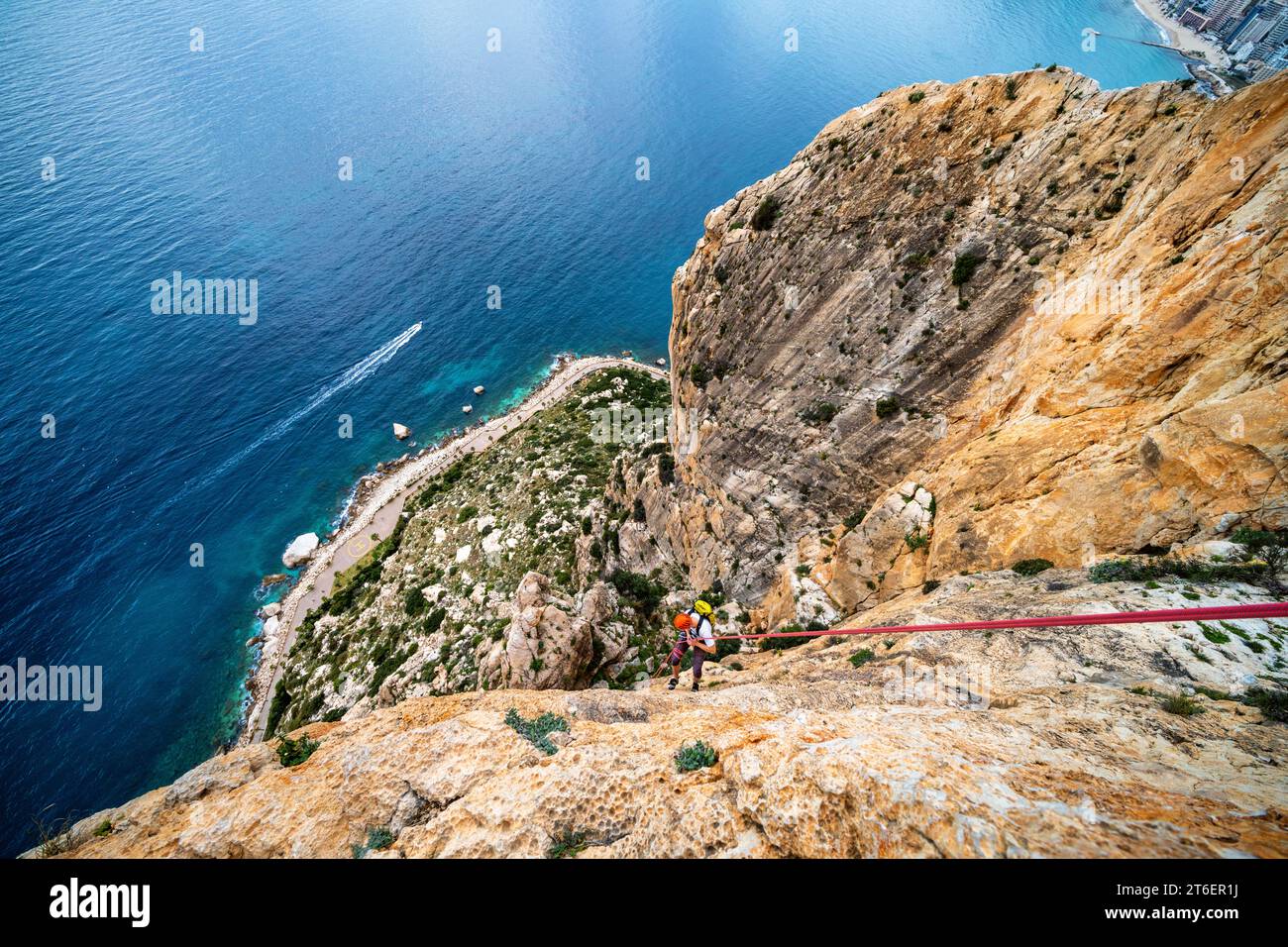 Trad rock climbing in Penyal d'Ifac National Park near Calp, Spain Stock Photo