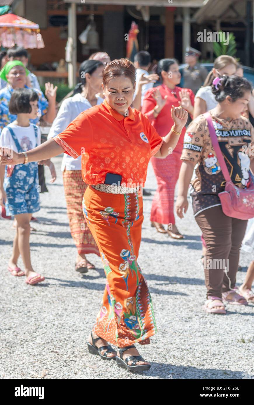 SURATTANI, THAILAND -NOV. 06, 2023: Burmese women dress in national clothes, Come out and dance happily at the Kathina merit-making ceremony of Burmes Stock Photo