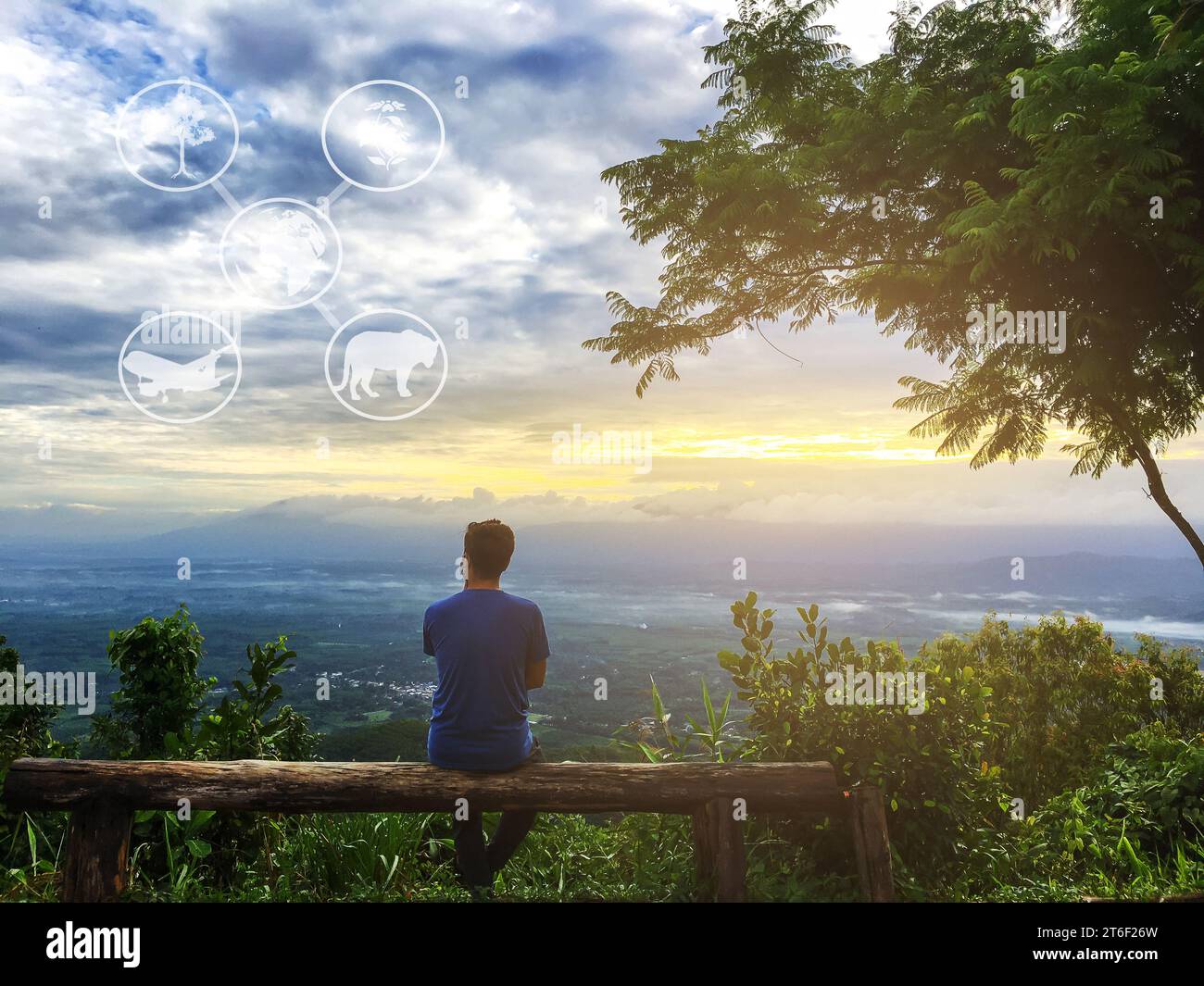 Sustainable tourism, Ecotourism, New tourism, Traveling with understanding without harming the Ecosystem, The man relax at mountain with sunrise and c Stock Photo