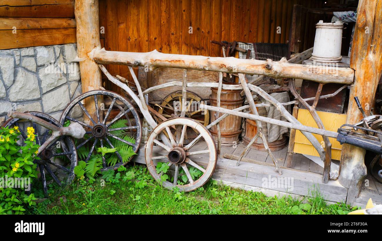 Vintage wooden cart wheels. Antiquarian transport. Old wooden two