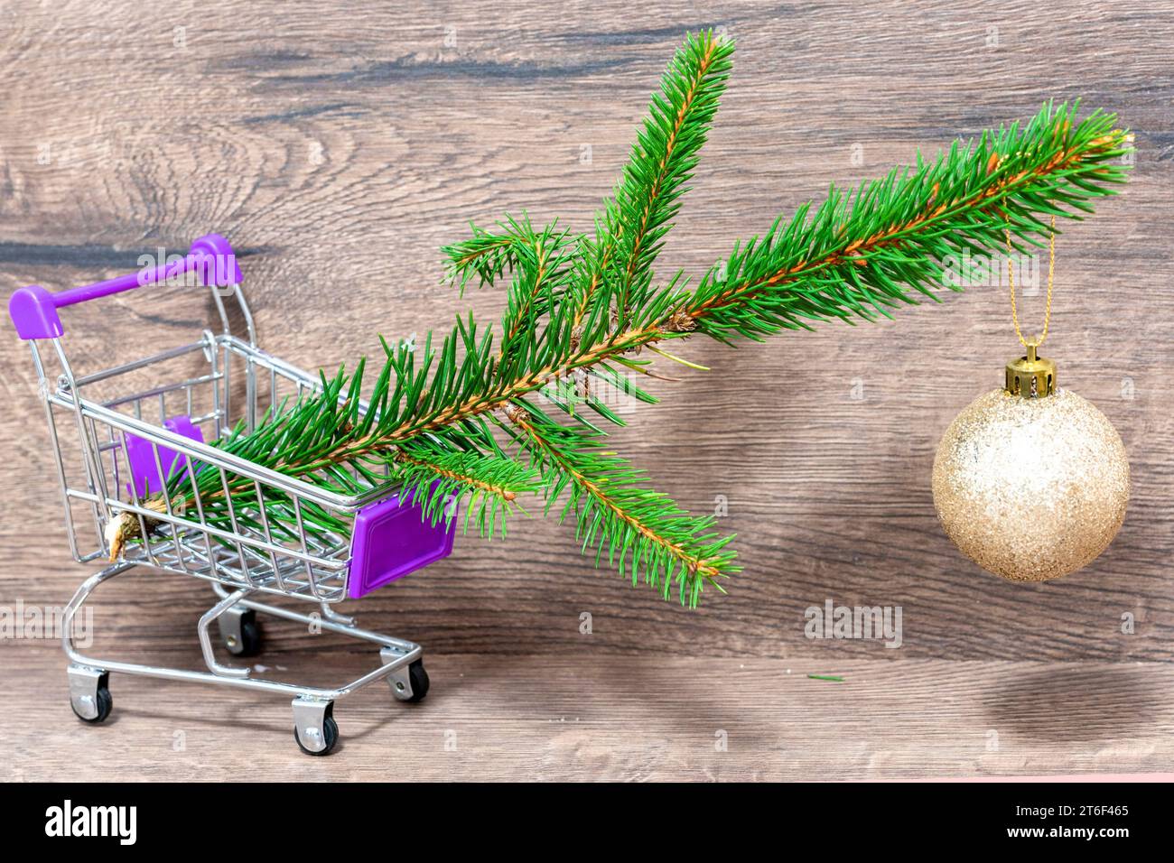 Trolley with Christmas decorations. Branches of a Christmas tree. Cart ...