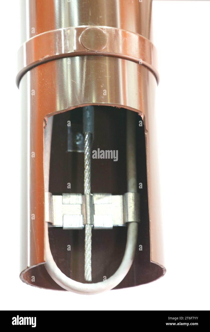 Close up on plastic gutter downspout drainage pipeline with deicing