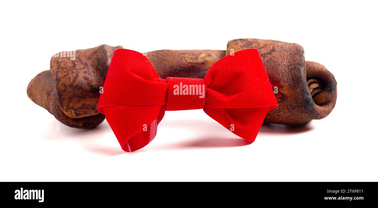 A Rawhide Dog Chew Toy Bone Isolated on a White Background with a Red