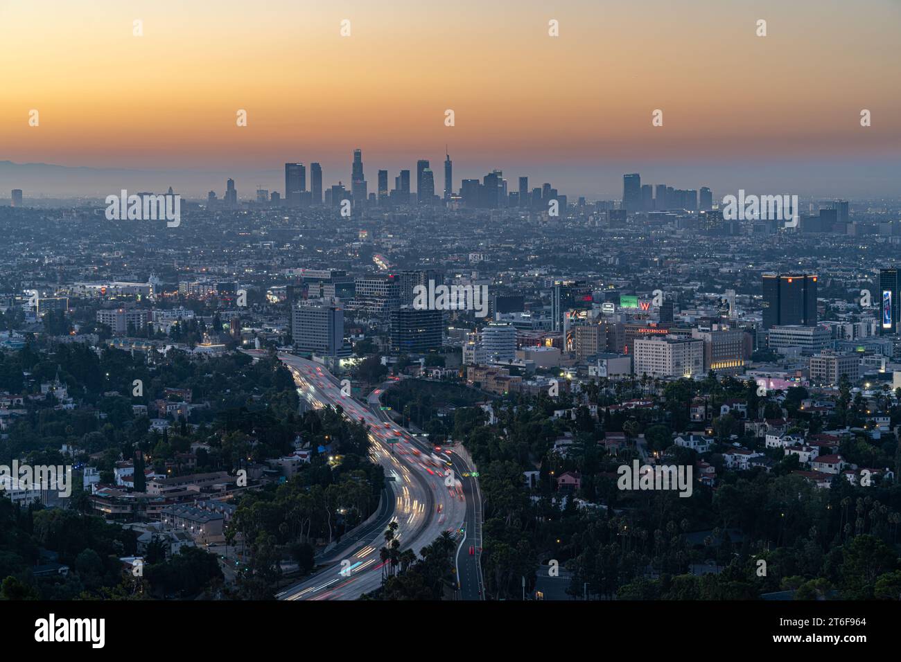 A stunning aerial view of a bustling city skyline at night showcases ...