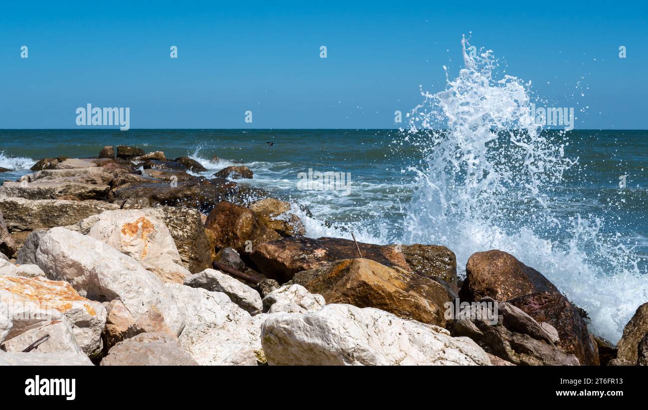 rocks on the beach with waves Stock Photo
