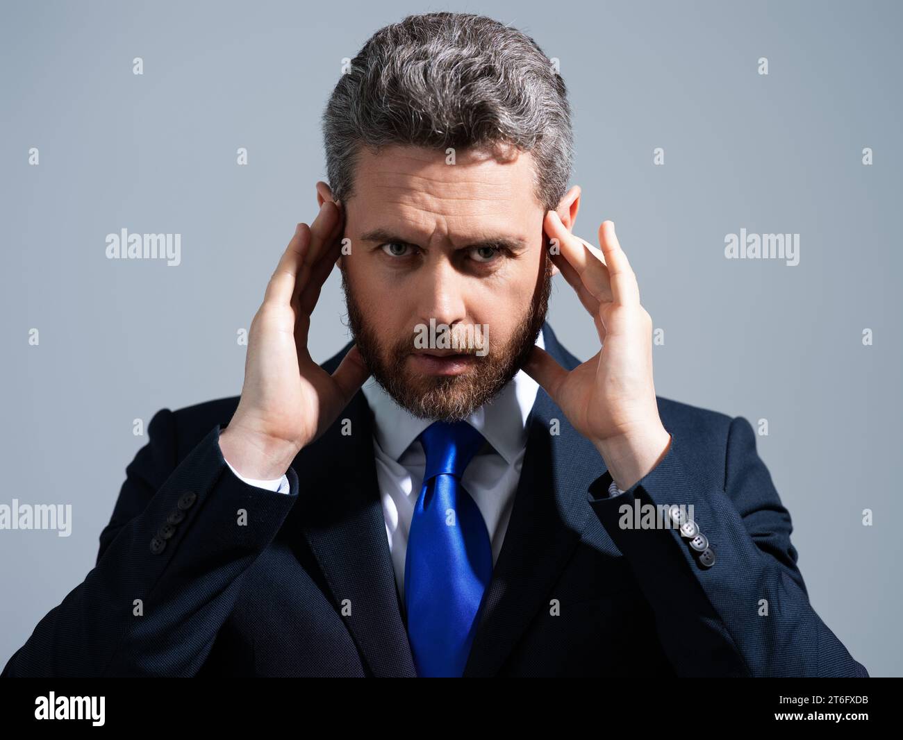 Tired, headache and eye strain. Businessman with stress, burnout and fatigue eyestrain. Business man rubbing tired eyes in studio. Vision problem, bad Stock Photo
