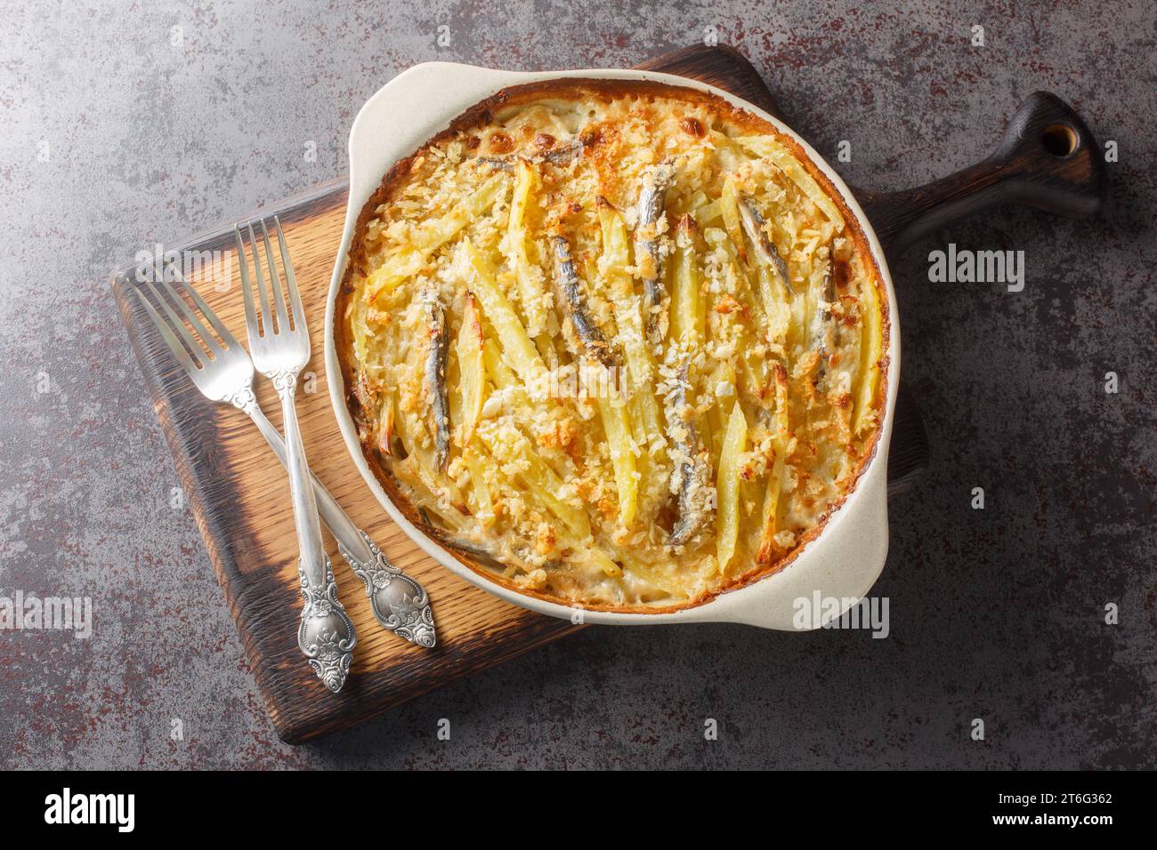 Janssons frestelse or Jansson's temptation is a creamy potato casserole traditionally served at Christmas in Sweden closeup on the baking dish on the Stock Photo