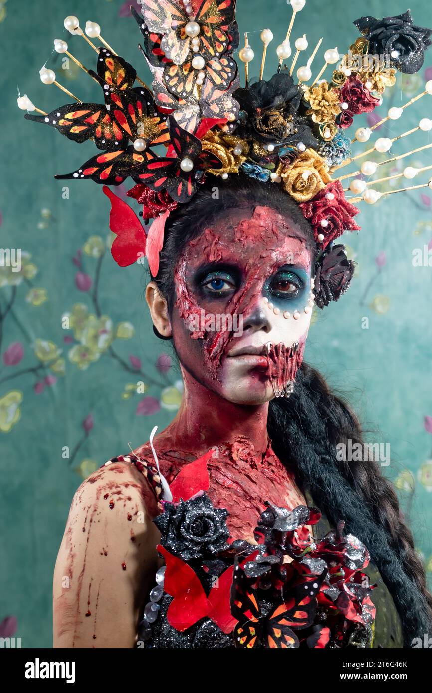 Closeup face of woman dressed in costume for Halloween Night.atmosphere covered by thin smoke.Creative, artistic, Halloween concept. Stock Photo