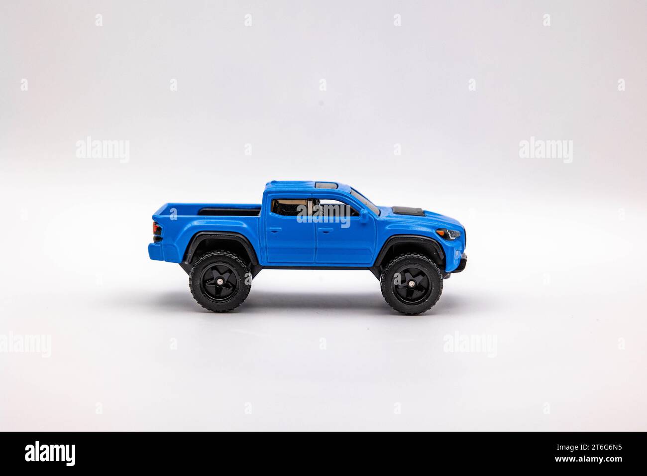 A detailed blue toy pickup truck on a white background Stock Photo Alamy