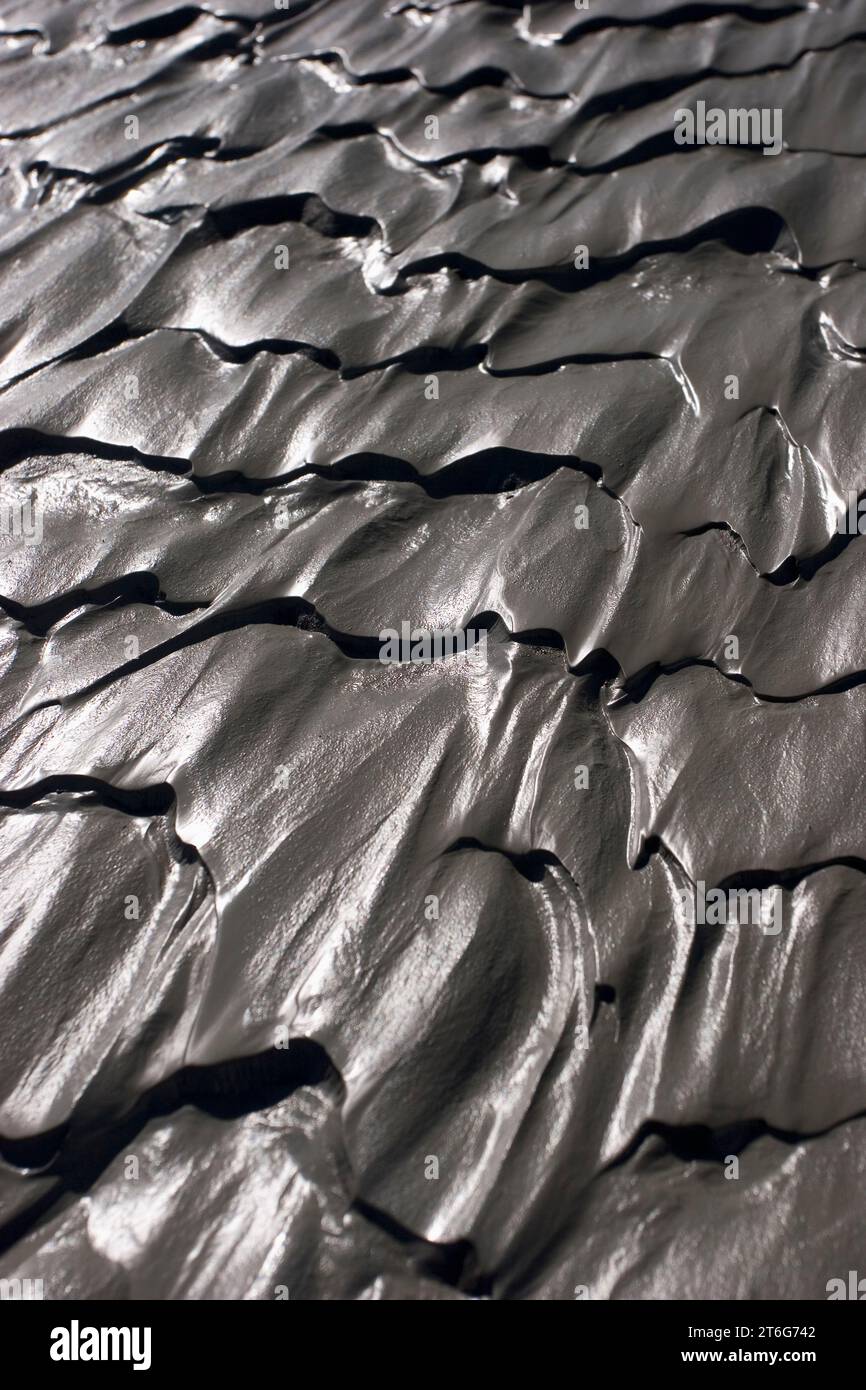 Ripples in the mud reflect sunlight, Kluane National Park, Yukon Territory. Stock Photo