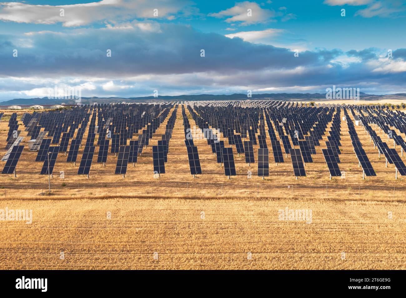 Aerial view of a solar power station and solar energy panels in a rural ...