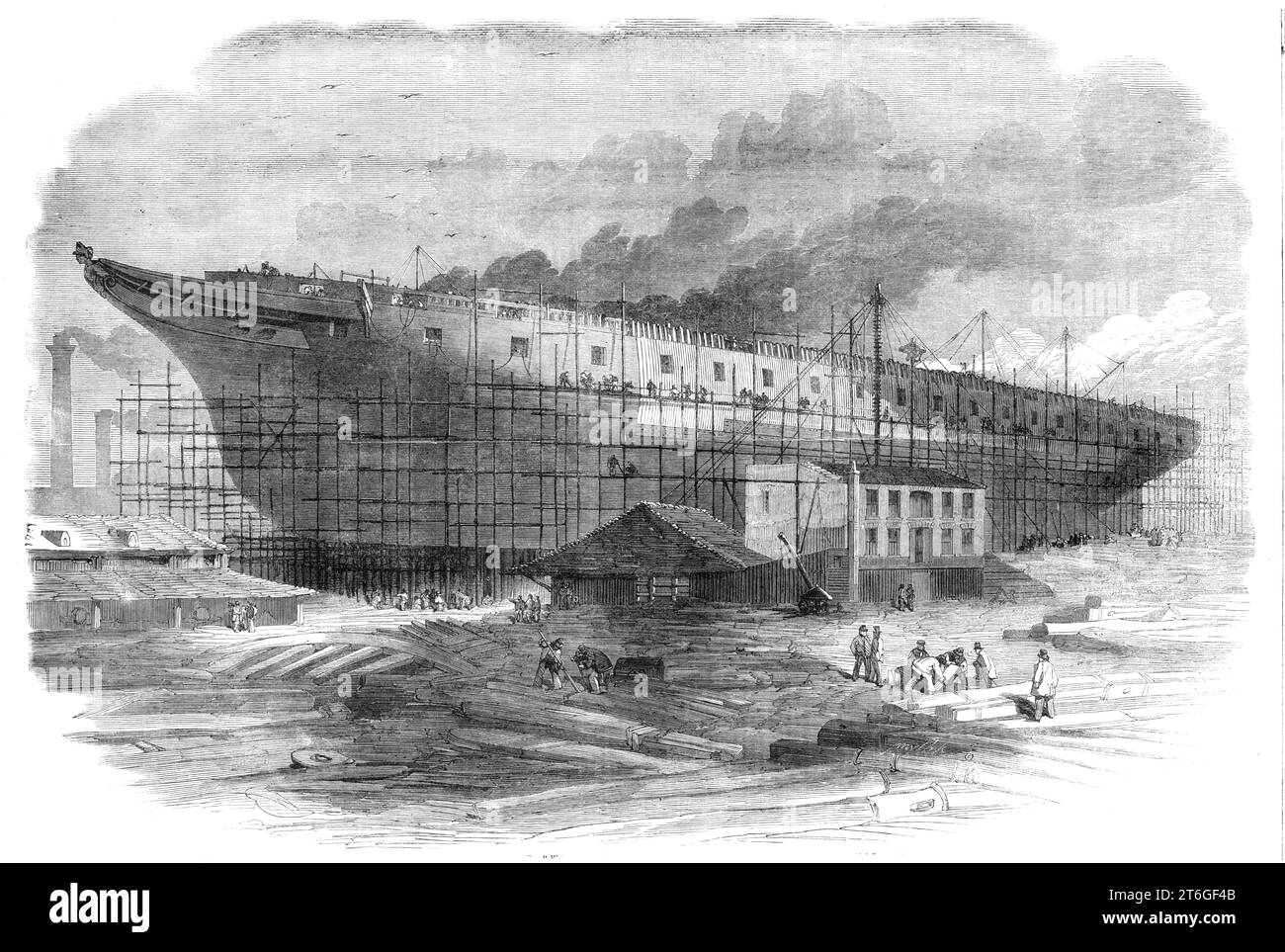 Building the great steam-frigate &quot;Warrior&quot; at the Thames Ironworks, Blackwall, 1860. Admiral Sir Baldwin Wake Walker, Surveyor of the Navy, was responsible for the Royal Navy's warship construction programme during the 1850s naval arms race and at the time of the introduction of the Ironclad warship. It was his decision to build HMS Warrior. She was the second largest ship in the world, after the Great Eastern, and was constructed, 'under the immediate superintendence of Captain Ford, the managing director'. The Warrior was armour plated, and built to carry 36 guns. From &quot;Illust Stock Photo