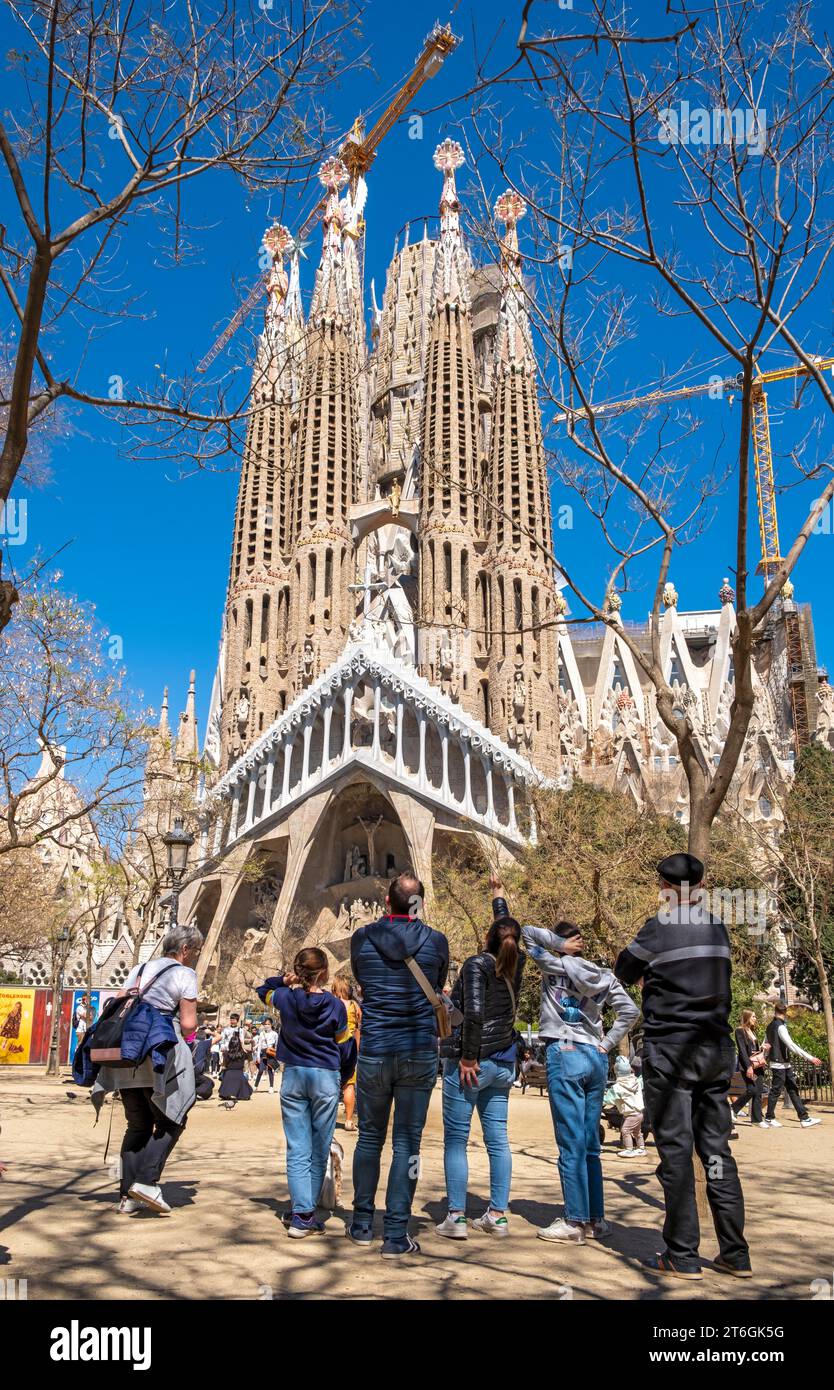 Visitors admire Sagrada Familia, Barcelona, Spain Stock Photo