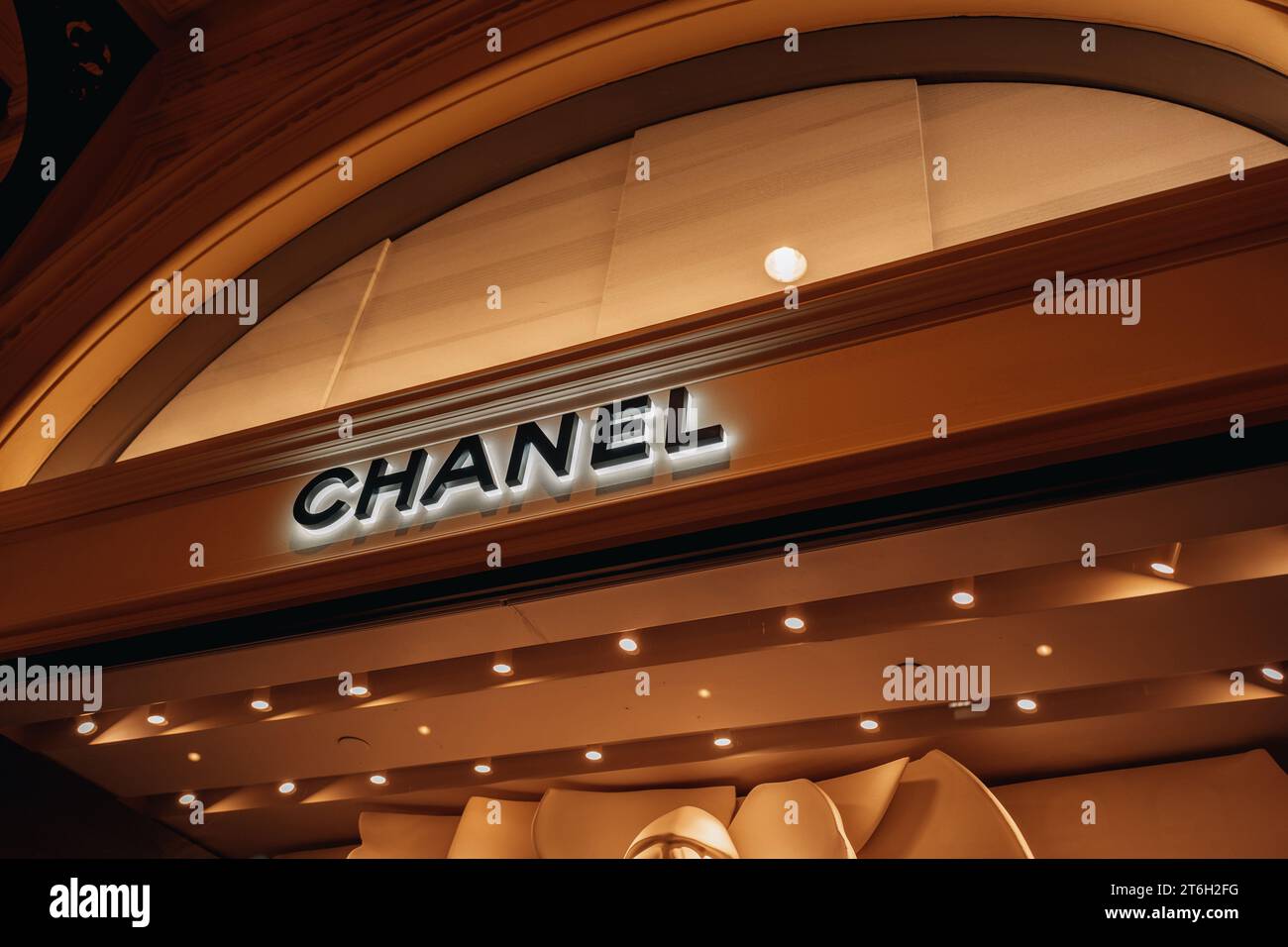 Chanel logotype. Classy luxury boutique showcase. Chanel is a fashion house founded in 1909 specialized in haute couture goods. Stock Photo